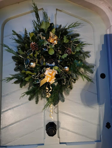 Large decorated holly wreath